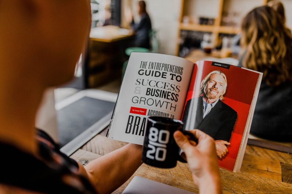 Top Tips For Aspiring Entrepreneurs, Busness book and coffee cup with Boss written on it