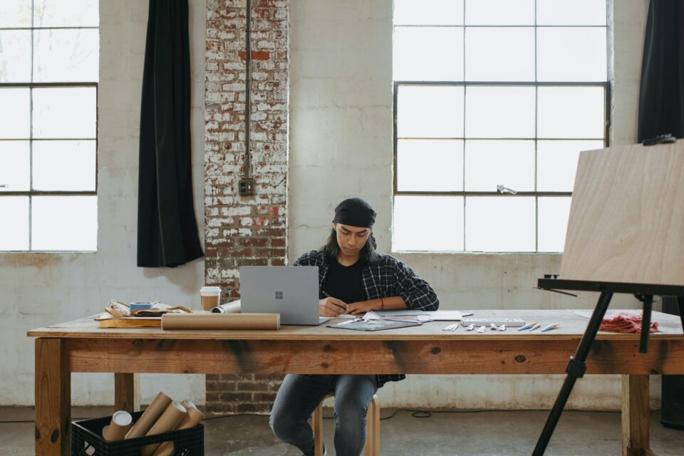 What Should You Do Before Starting A Business, man with laptop at a desk